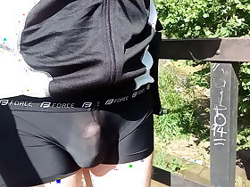 Translucent cyclodress bike ride in public. Cycling in extreme weather.