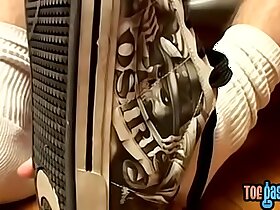 Thug jock Evan Heinze caressing socks in foot fetish solo