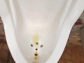 Pissing at public urinal, showing power of my kegel muscles ;)